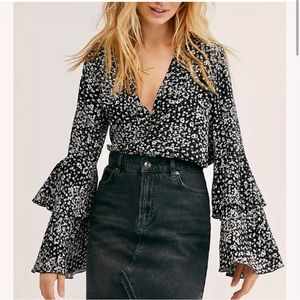 Free People Ditsy Floral V Neck Long Bell
Ruffle Sleeve Bodysuit Black Small
